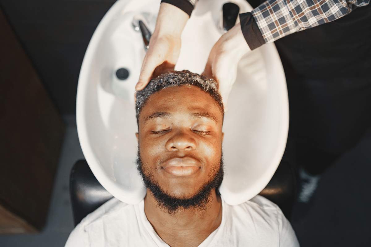 Man Having His Hair Washed in a Hair Salon 